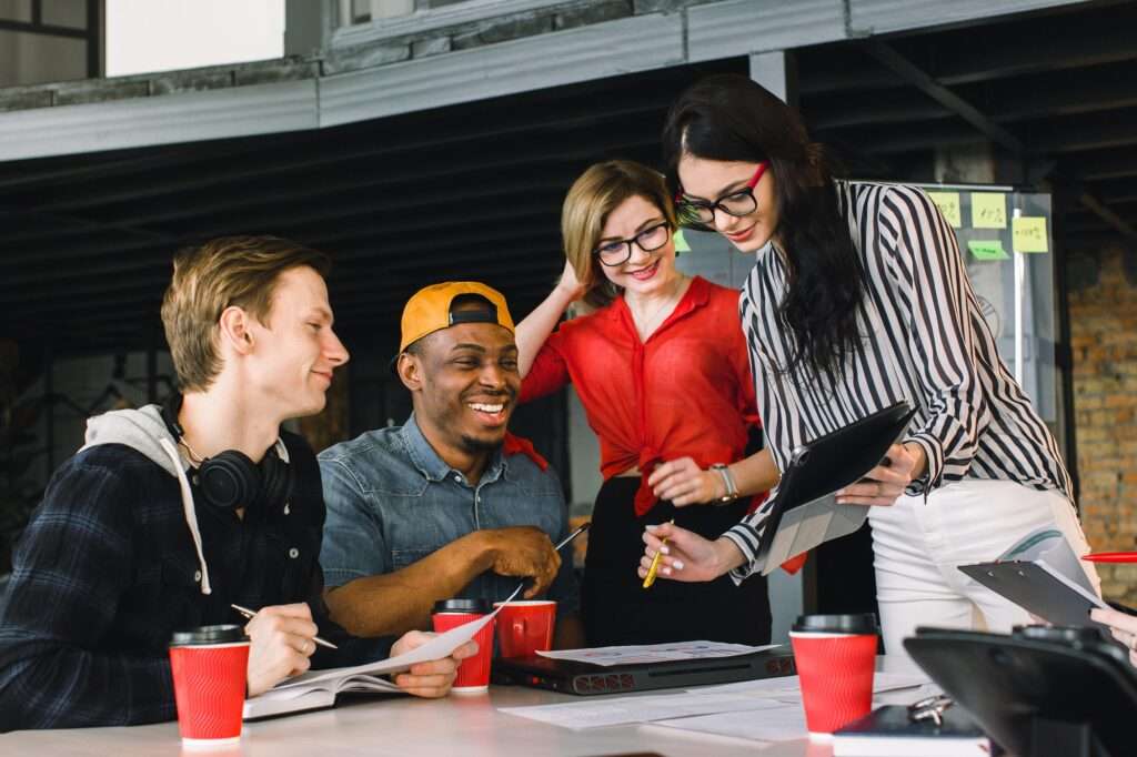 multiracial young creative people in modern office. Group of young business people are working